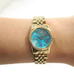 mk3271-michael-kors-watch-women-blue-dial-metal-stainless-steel-gold-strap-quartz-battery-analog-three-hand-lexington-mini.webp