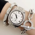 mk6133-michael-kors-watch-women-crystals-silver-dial-metal-stainless-steel-strap-quartz-battery-square-analog-three-hand-bryn.webp