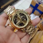 mk6272-michael-kors-watch-unisex-black-gold-dial-metal-stainless-steel-golden-strap-quartz-battery-analog-chronograph-bradshaw.webp