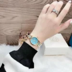 mk6673-michael-kors-watch-women-pyramid-crystals-blue-dial-metal-stainless-steel-gold-strap-quartz-battery-analog-three-hand-runway.webp