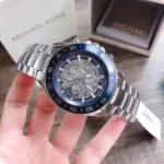 mk9024-michael-kors-watch-men-blue-dial-metal-stainless-steel-silver-strap-automatic-analog-three-hand-jet-master.webp