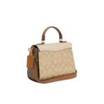 on-model-2-coach-morgan-top-handle-bag-in-blocked-signature-canvas-light-khakikhaki-multi_1000x-4-outlet90-com